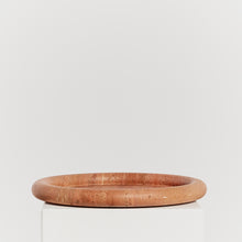 Load image into Gallery viewer, Travertine doughnut platter in vibrant coral tones
