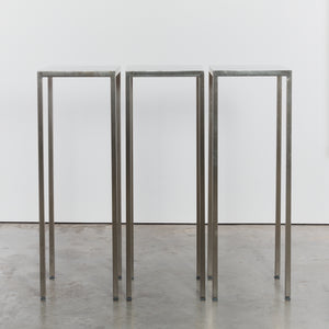 Tall stainless steel display plinths