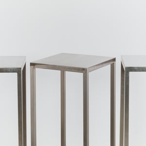 Tall stainless steel display plinths