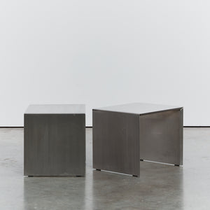 Pair of bent stainless steel tables