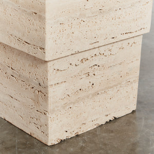 Unfilled travertine stepped plinth