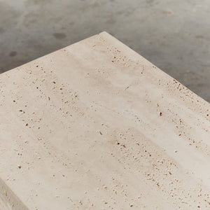 Unfilled travertine stepped plinth