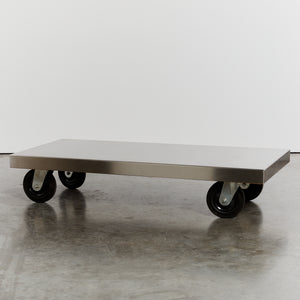 Stainless steel coffee table on castors