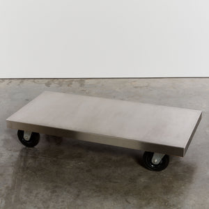 Stainless steel coffee table on castors