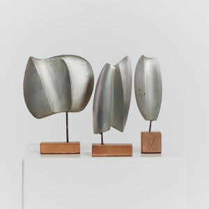 Trio of cast aluminium sculptures