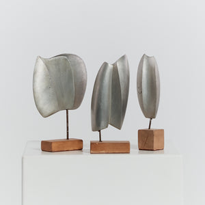 Trio of cast aluminium sculptures