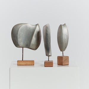 Trio of cast aluminium sculptures