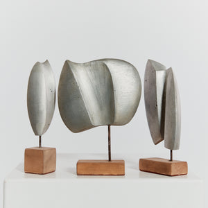 Trio of cast aluminium sculptures