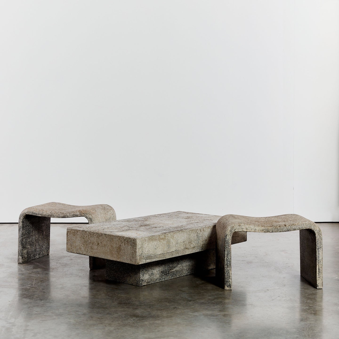 Concrete outdoor table and sculptural stools