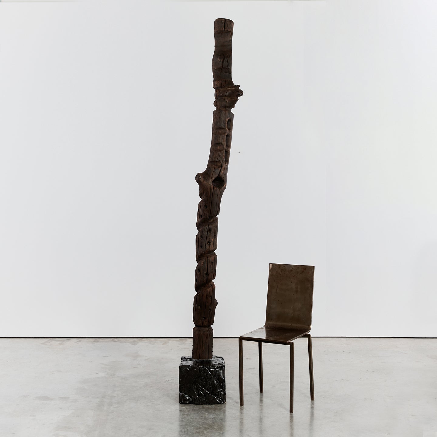 Brutalist wood totem floor sculpture on plinth