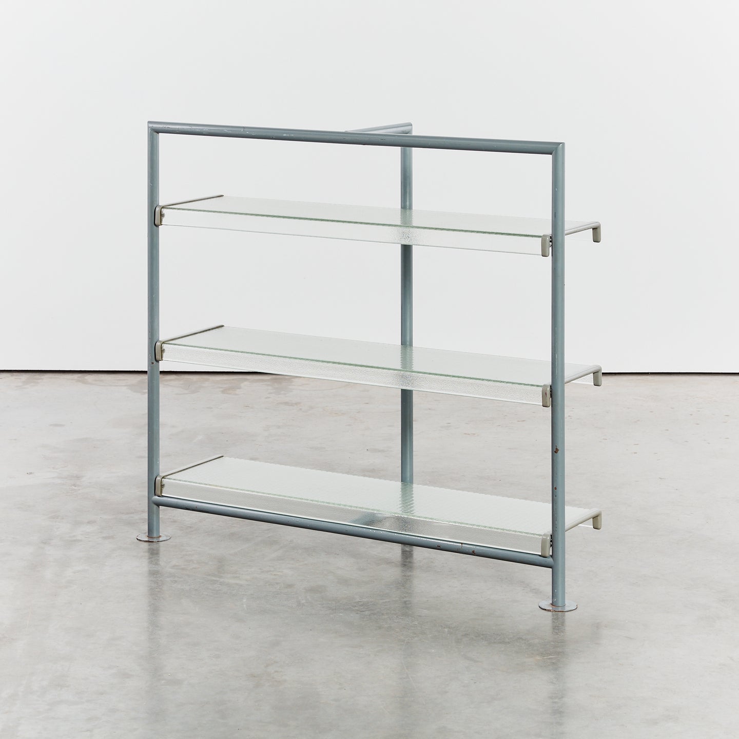 Reinforced glass shelves with steel frame