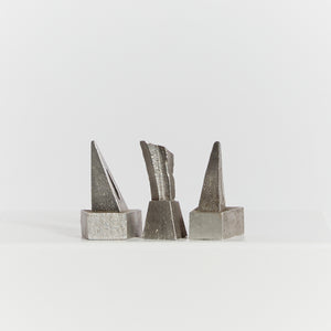 Trio of cast aluminium sculptures with bases