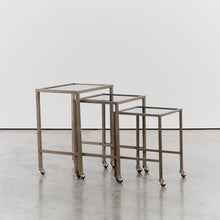 Load image into Gallery viewer, Trio of nesting tables on castors
