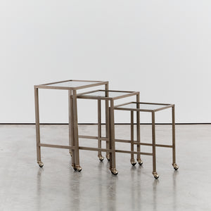 Trio of nesting tables on castors