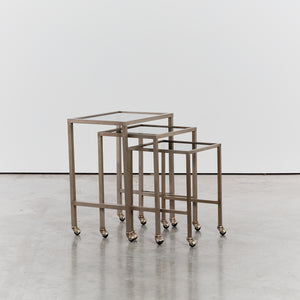 Trio of nesting tables on castors