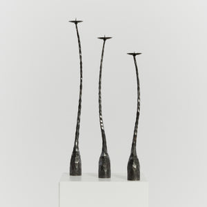 Trio of brutalist iron candlesticks