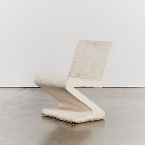 Cast concrete cantilever S chairs