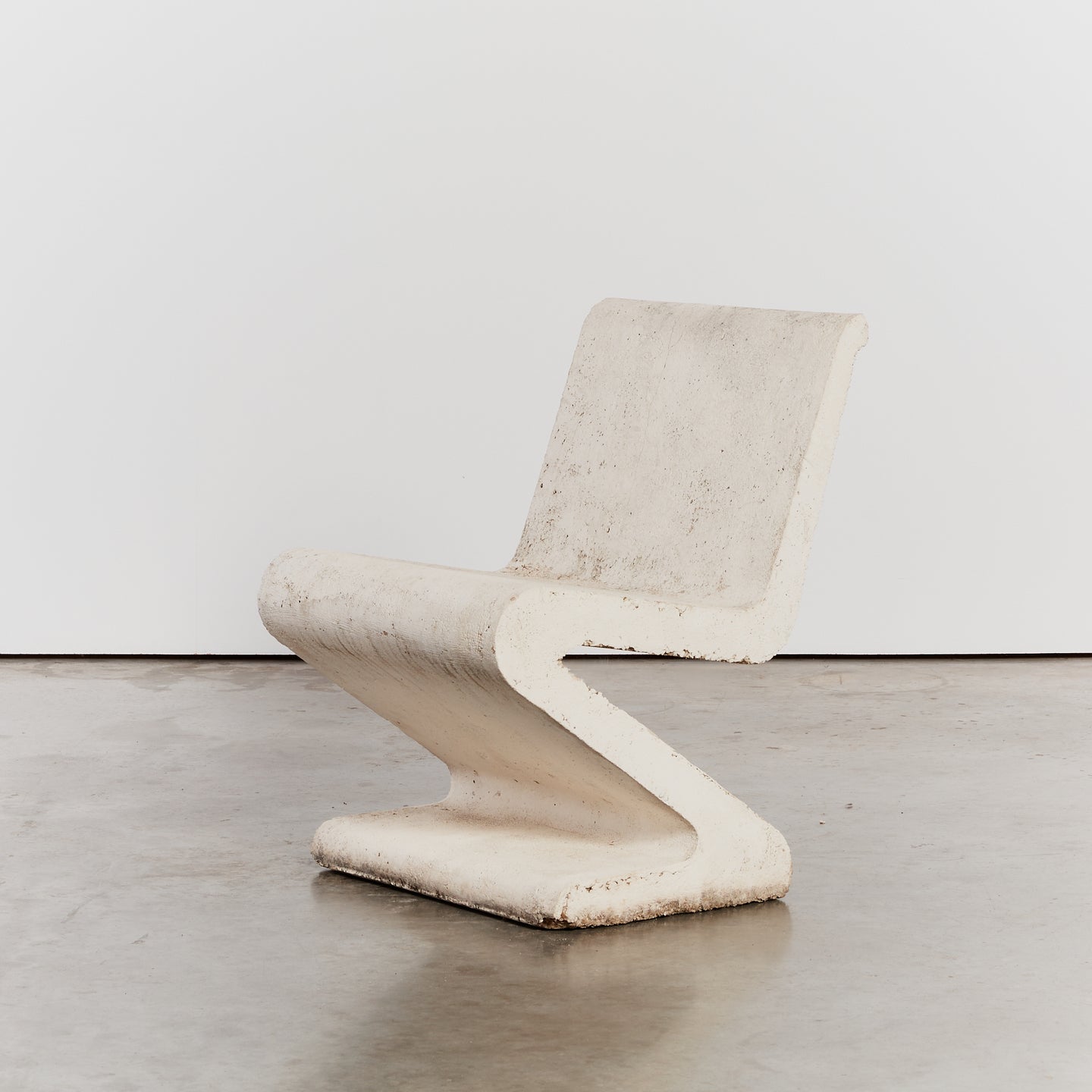Cast concrete cantilever S chairs