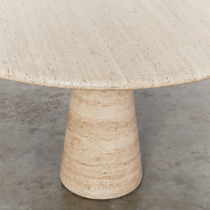Round travertine dining table with conical base