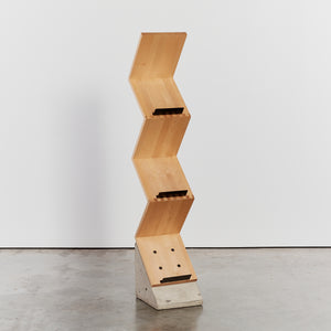 Timber bookshelf on concrete base by Jonas Bohlin