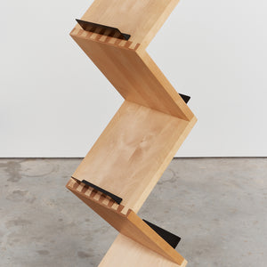 Timber bookshelf on concrete base by Jonas Bohlin