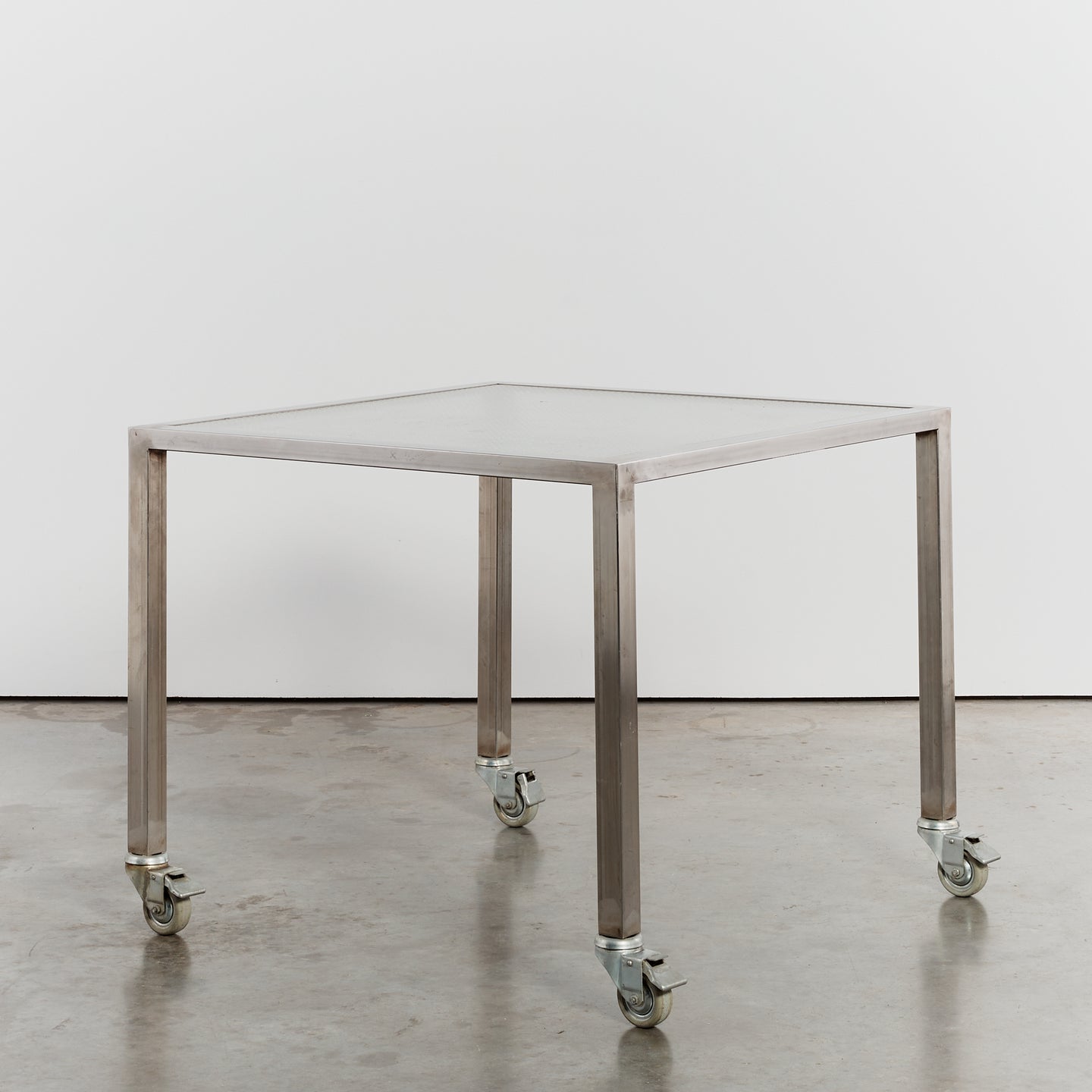 Steel and glass desk on castors by Thomas Wendtland