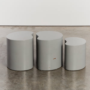 Trio of grey kidney shaped plinths - HIRE ONLY