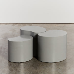 Trio of grey kidney shaped plinths - HIRE ONLY