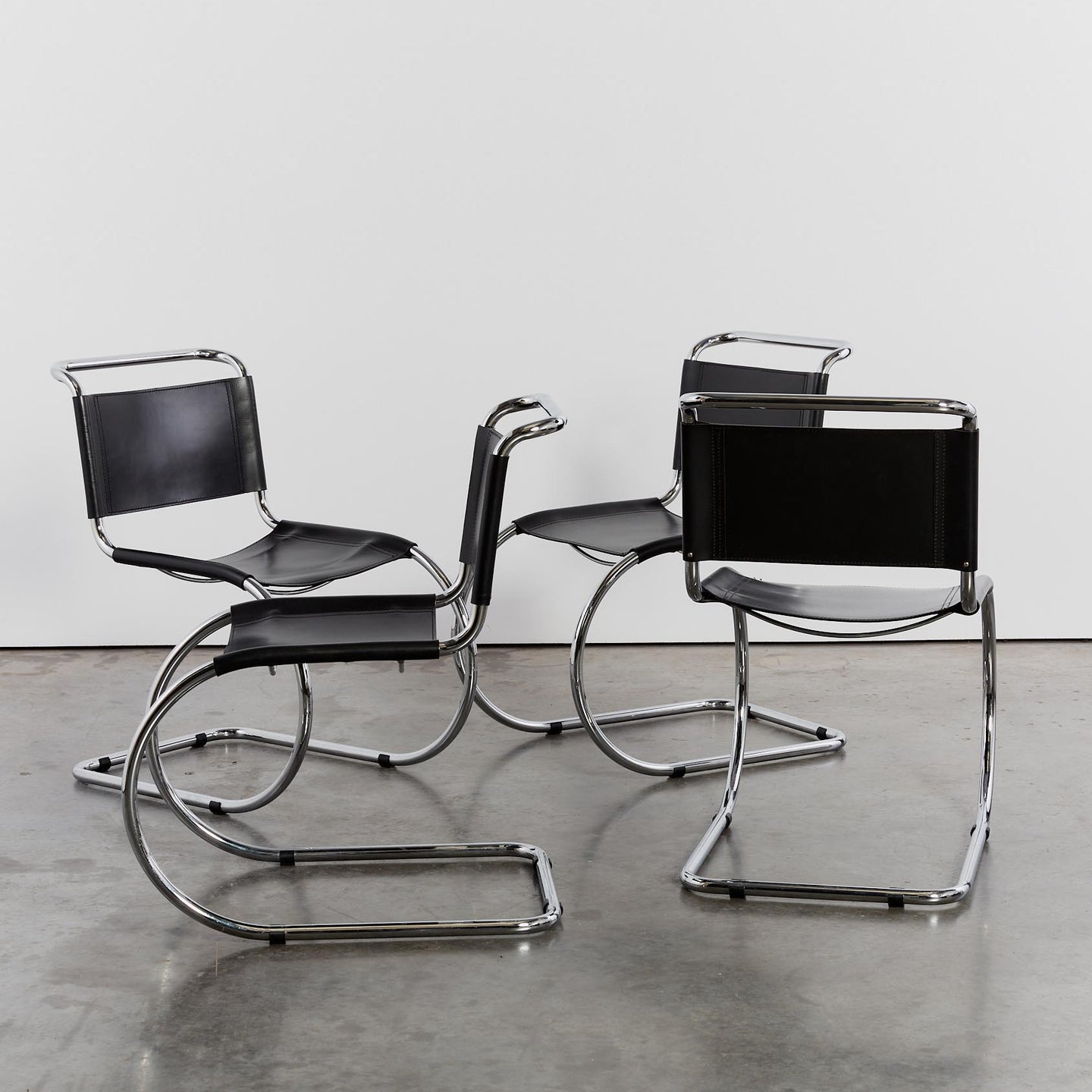 Modernist tubular chrome and leather chairs x4 - HIRE ONLY