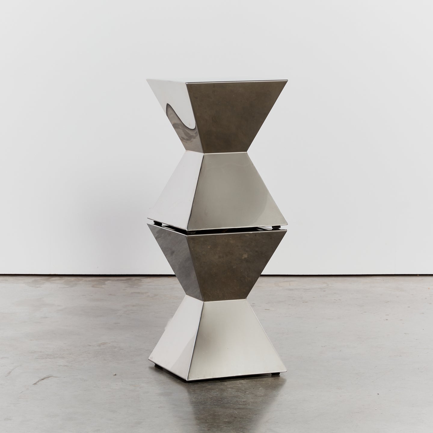 Pinched waist polished steel plinths - HIRE ONLY