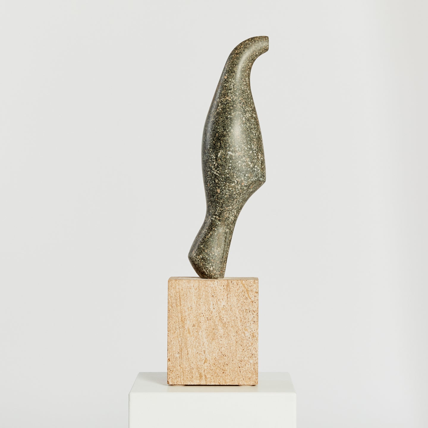 Granite bird sculpture, with contrasting stone base