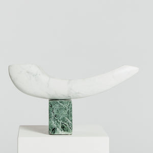 Carrara marble arc sculpture on green marble plinth