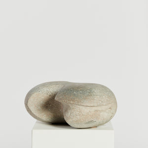 Cutaway stone pebble floor sculpture