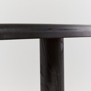 Ebonised dining table with column legs