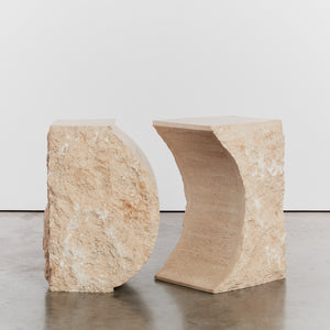 Sculptural raw edged console in travertine