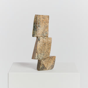 Tiered stone sculpture in pale green/yellow tones