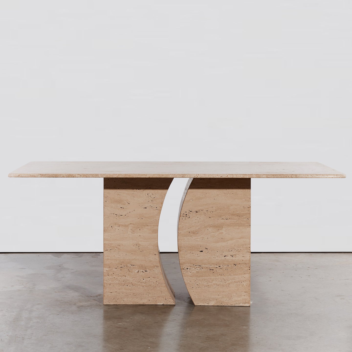 Sculptural travertine dining table
