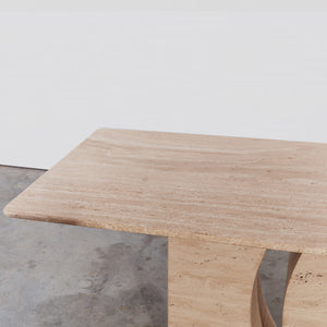 Sculptural travertine dining table