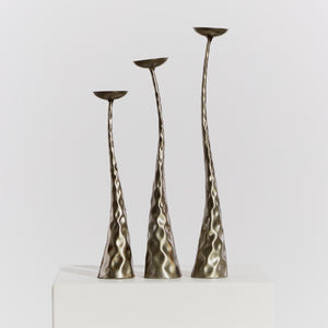 Trio of textured metal candlesticks