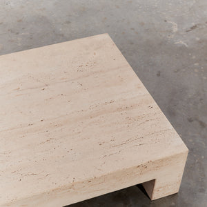 Low monolithic travertine coffee table