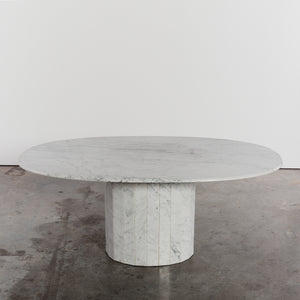 Faceted Carrara marble oval dining table
