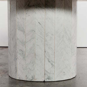 Faceted Carrara marble oval dining table